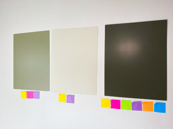 Painted foam boards with corresponding color coded sticky notes beneath them