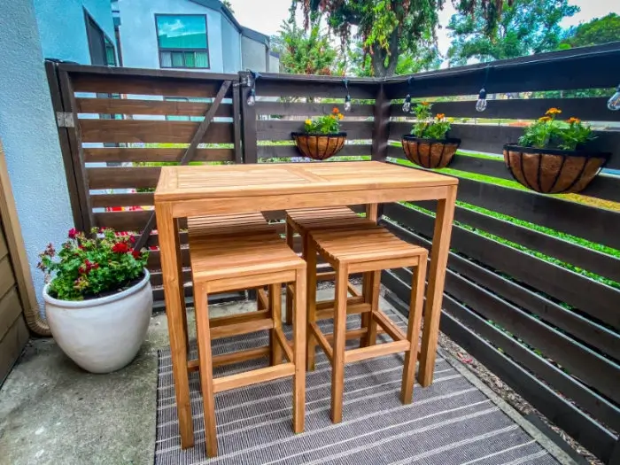 An outdoor dining set lends charm to the patio