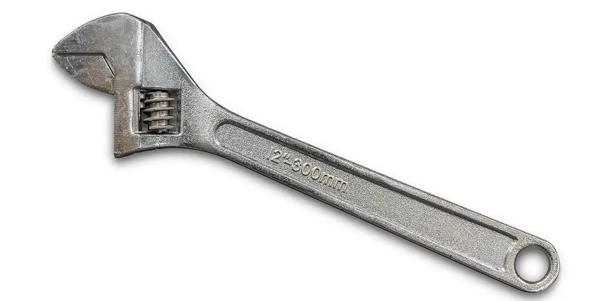 A Crescent wrench on a white background.