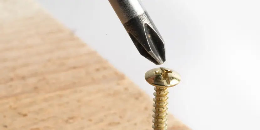 Closeup of a Phillips head screwdriver and screw