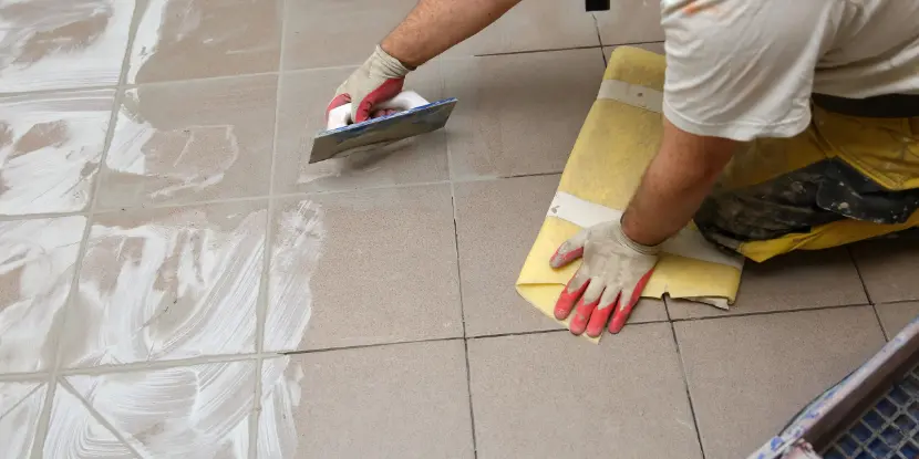 Applying new grout to a tile floor