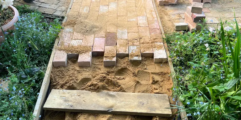 Recycled bricks lain on a sand bed