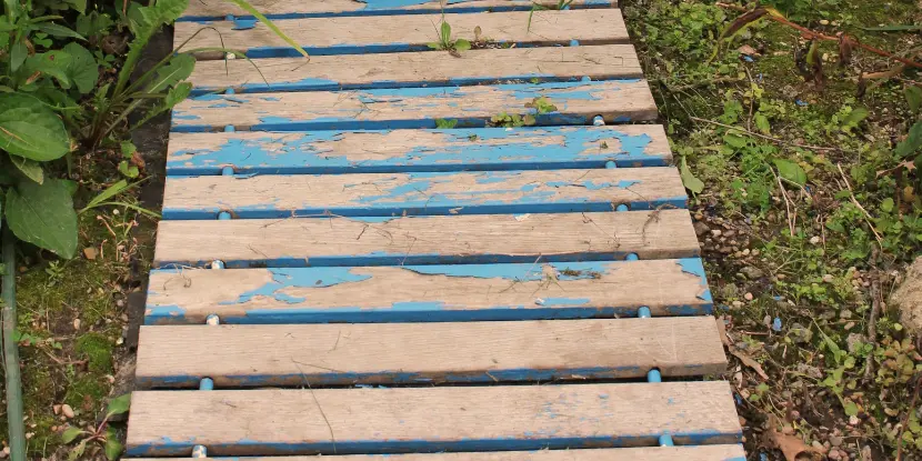 An old wood path with chipping paint