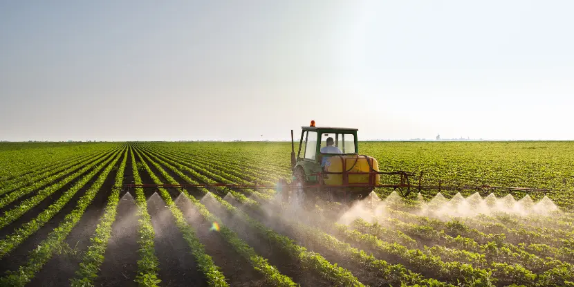 A farmer spraying his field