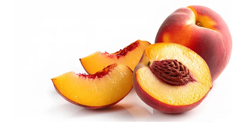 A sliced peach with yellow flesh