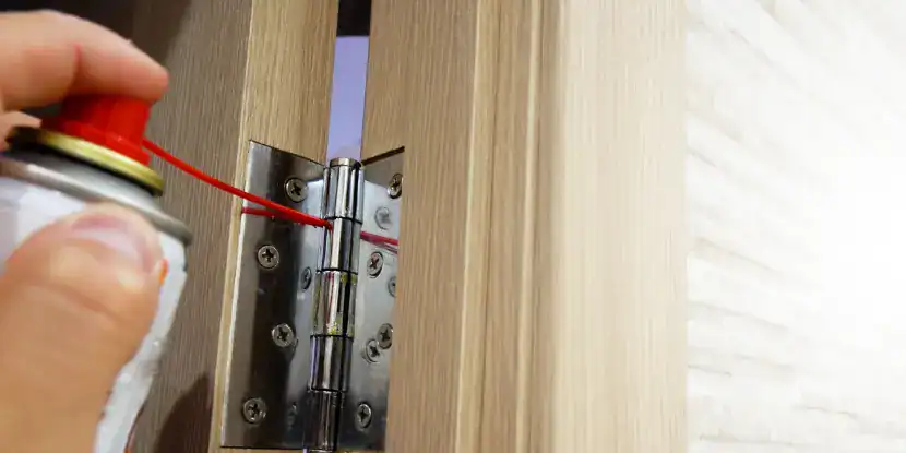 Lubricating a door hinge