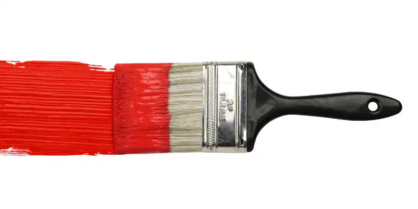 A paint bush with red paint