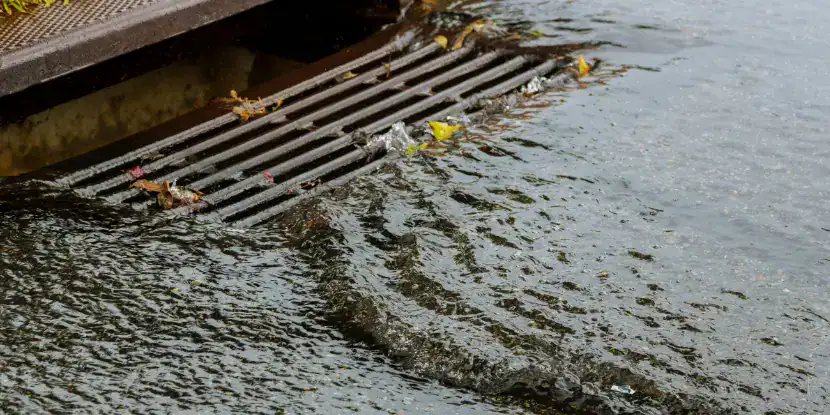 A storm drain filling with water
