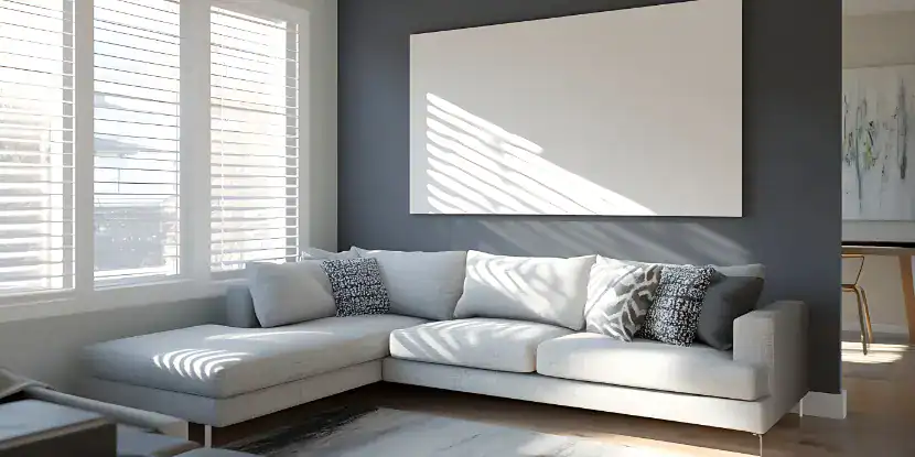 A living room with a charcoal wall