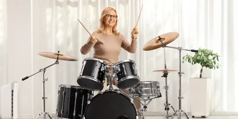 A woman with a drum kit