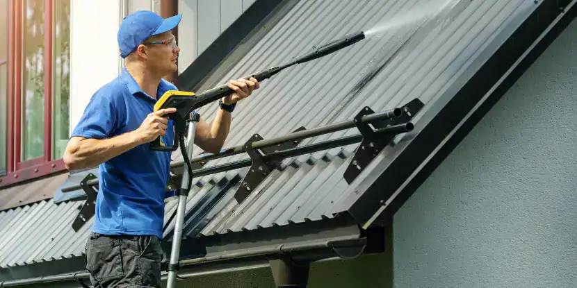 Power washing a metal roof