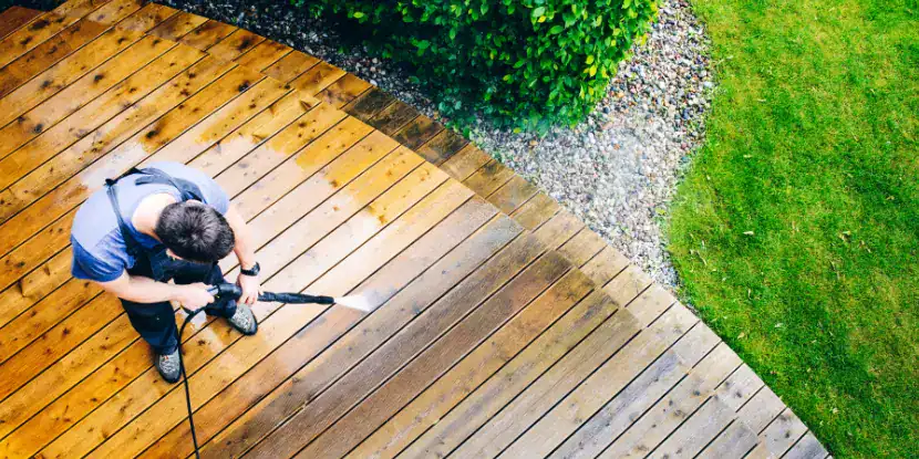Power washing a wooden deck