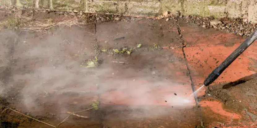 A clean tile walkway shines after power washing