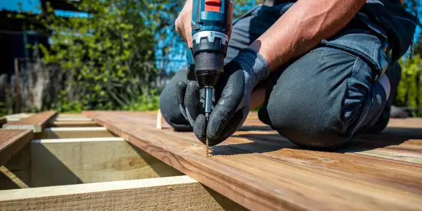 A man builds a deck