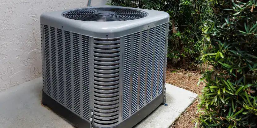 An air conditioning unit on a concrete slab