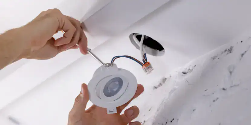 Flexible fiber optic cable installation in ceiling construction for building infrastructure projects.