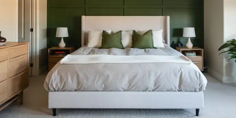 Bedroom with an olive green accent wall